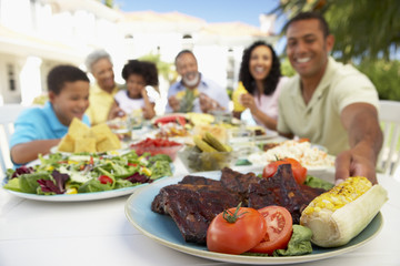 Family Eating An Al Fresco Meal