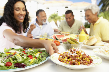 Family Eating An Al Fresco Meal