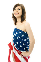 beautiful young woman wrapped into the American flag