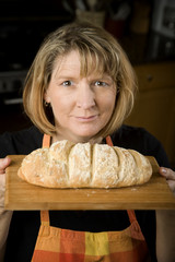 Woman in Kitchen with Bread