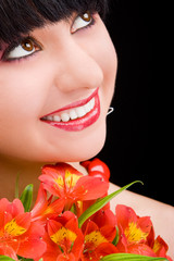 Fototapeta na wymiar Young woman with flowers
