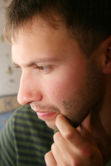 Obraz premium Young man portrait, thinking