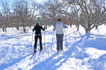 Two girls skiing.