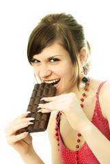 young brunette woman eating chocolate