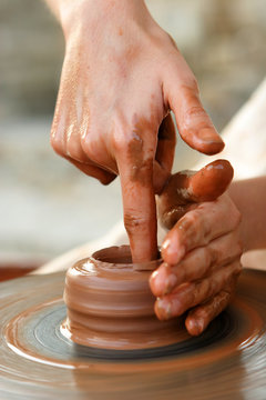 Potter's hands at work