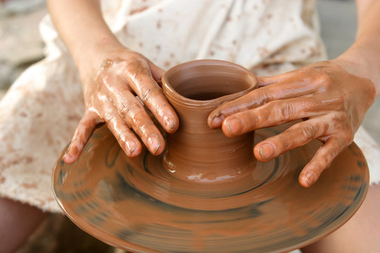 Potter's hands at work