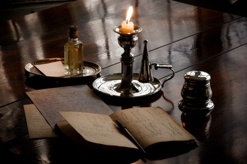 Letter by candlelight near window