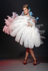 Burlesque artist with ostrich feather fan