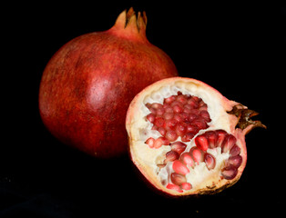 Pomegranate isolated on black background
