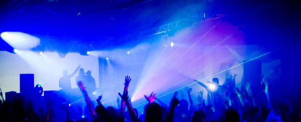 Panoramic photo of people hanging out at the concert