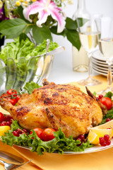 Whole roasted chicken on table