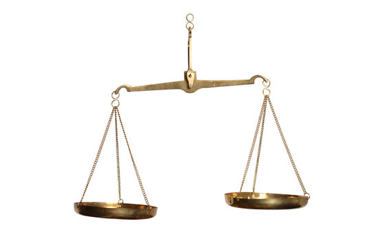 Vintage old brass balance hanging isolated on white