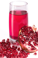 Glass filled by juice of a pomegranate