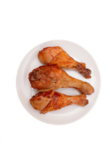 Chicken legs on the plate.