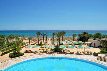 Palm trees, beach, bright sun, yellow sand