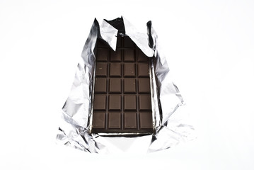 chocolate on a foil on a white background is isolated