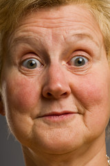 Mature woman pulls silly face