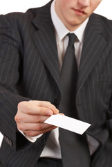 businessman holding blank card