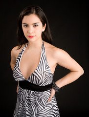 Fototapeta premium Beautiful Brunette Lady Posing in a Black and White Dress
