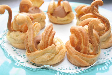 Bread on green plate in goose or swan model