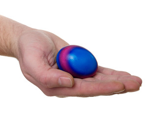 hand with colorful Easter egg