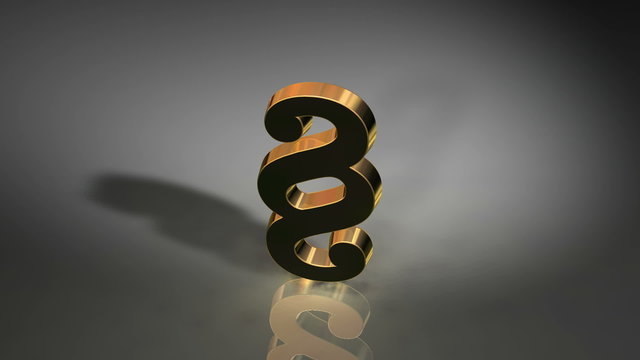 Rotierendes goldenes Paragraphen Zeichen