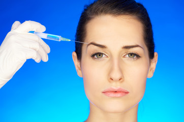 Portrait of Beautiful woman, she recieving a botox injection