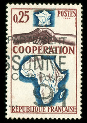 vintage French stamp with handshake and map of Africa