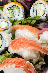 sushi sashimi shrimp tuna salmon seafood with california rolls