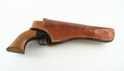 Pistol in leather holster