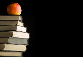 A red apple on a books