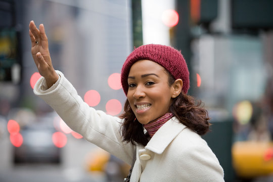 Woman Hailing A Cab