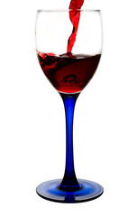 Red wine flowing to a glass. clipping path