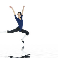 Fototapeta na wymiar Ballerina jumping with reflection