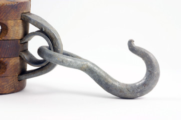 Antique block and tackle hook for hoisting heavy objects.