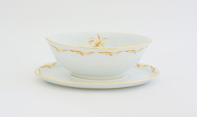 Vintage gravy bowl with gold wheat design.