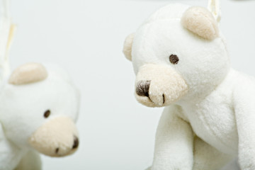 smiling little teddy bears hanging from the mobile