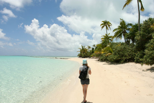Girl walking on Tropical island beach