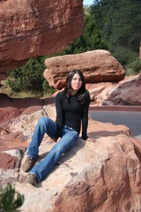 Pretty Teen Girl Sitting on Rock