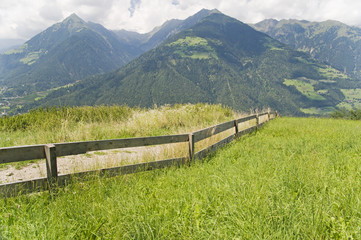 Fototapeta na wymiar wooden fence with mountains