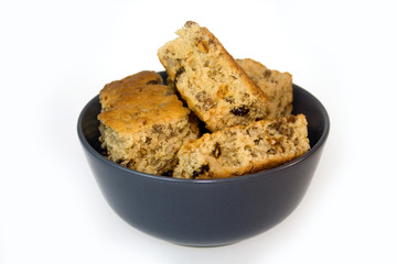 Home baked rusks in a blue bowl
