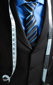 Business man with tape measure