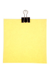 Blank paper held by clip on white background