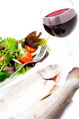 Health foods selection with red wine on white