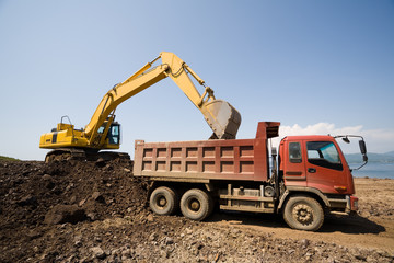 excavator and  truck