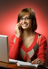 Beautiful smiling woman working on her laptop