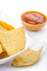 maize chips in white bowl and salsa sauce