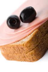 bread with sausage and olives isolated