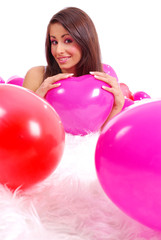 sexy girl lying on floor among balloons