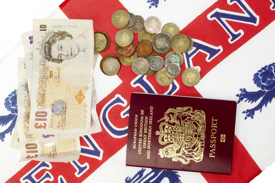 Passport and money on an english flag